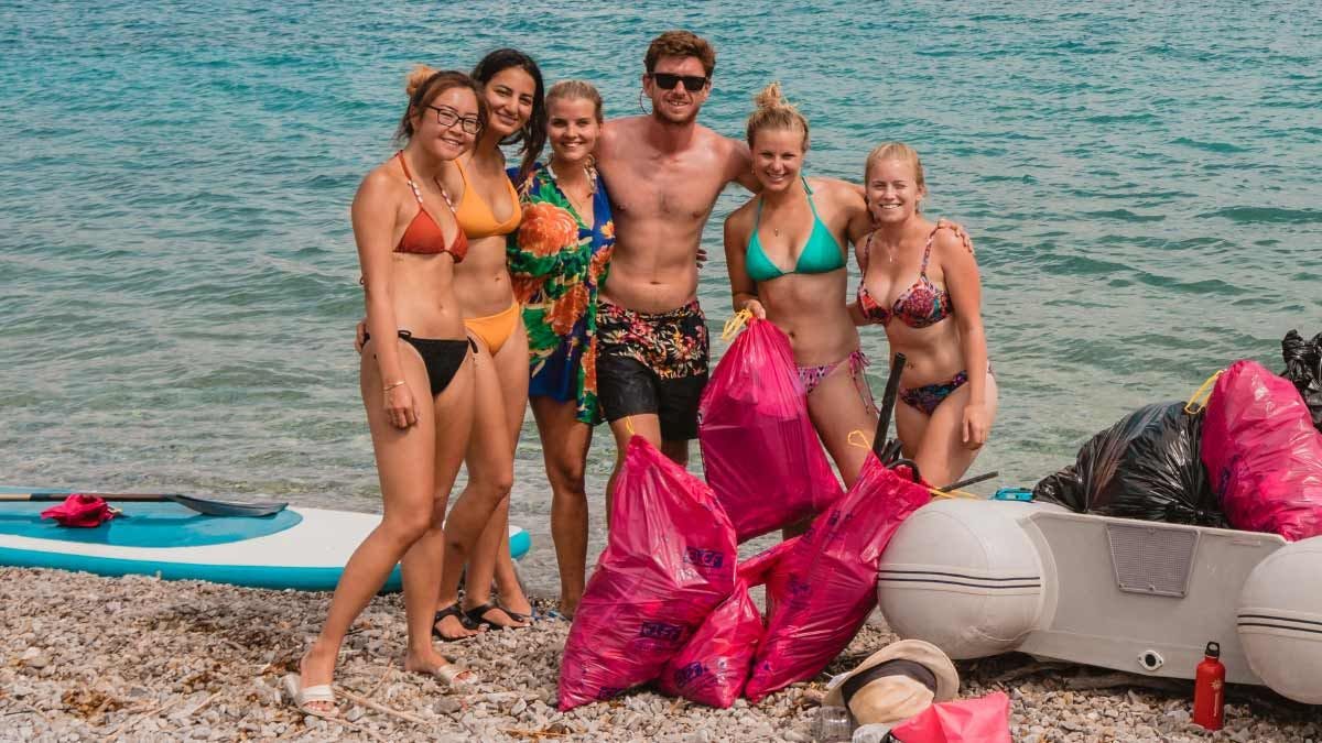Group of MedSailors guests doing a beach clean up in Greece
