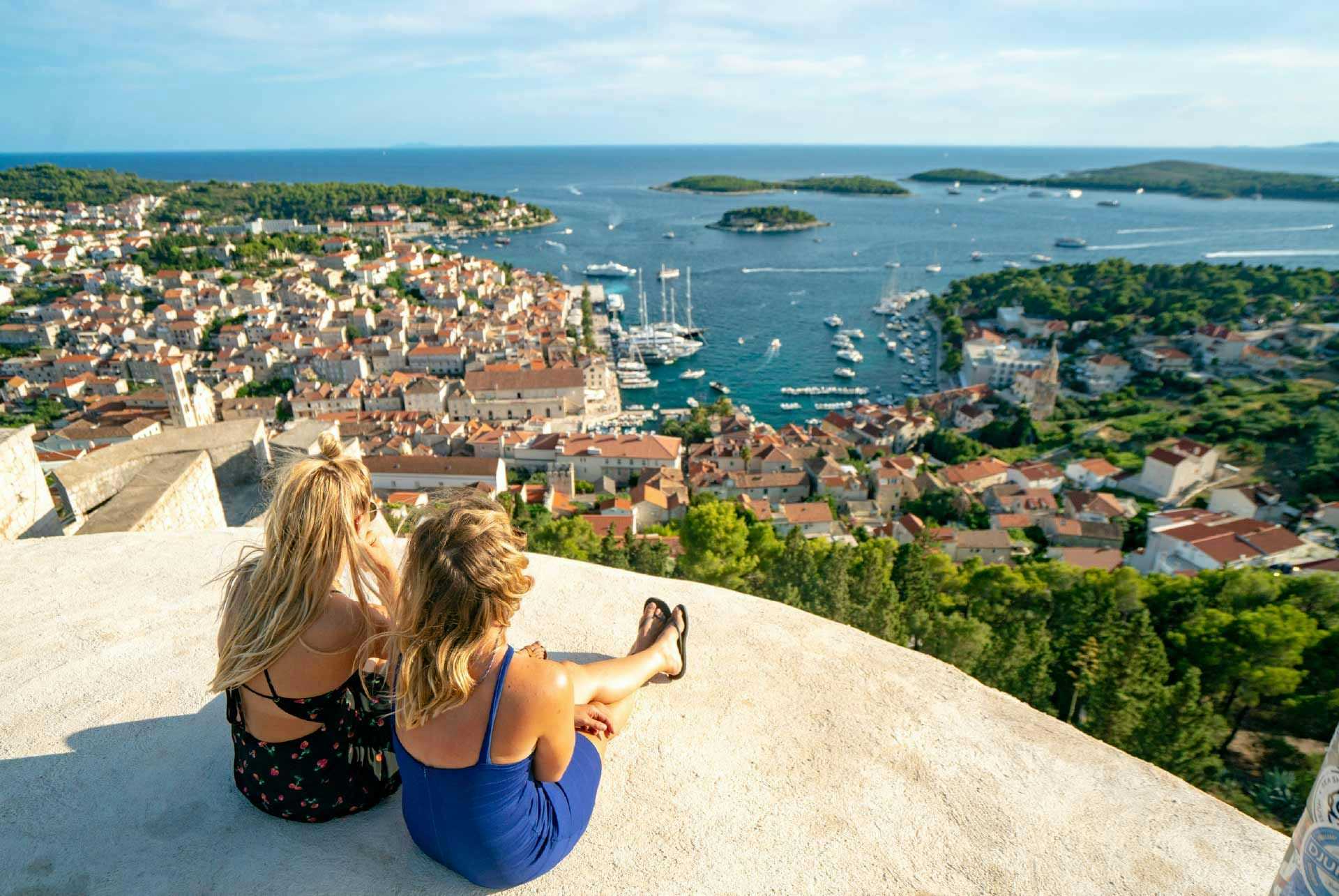 Two women looking at the view over Hvar from the fortress