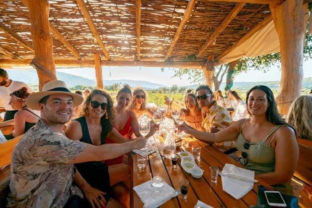Group of people have meal at Hora Farm in Croatia