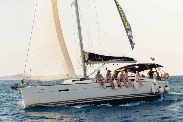 Photo of a sailing yacht with guests sailing in the Greek Saronic. 