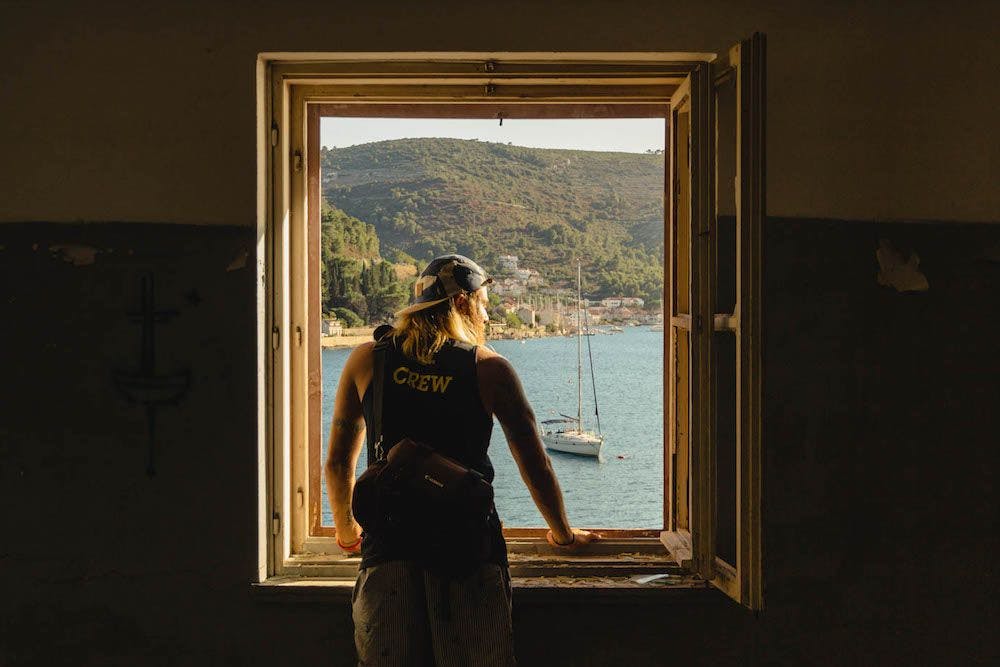 Looking out of a window in a villa in Vis, Croatia. Photo by Ryan Brown of Lostboymemoirs.com