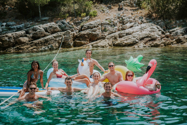 Guests swimming with inflatable toys