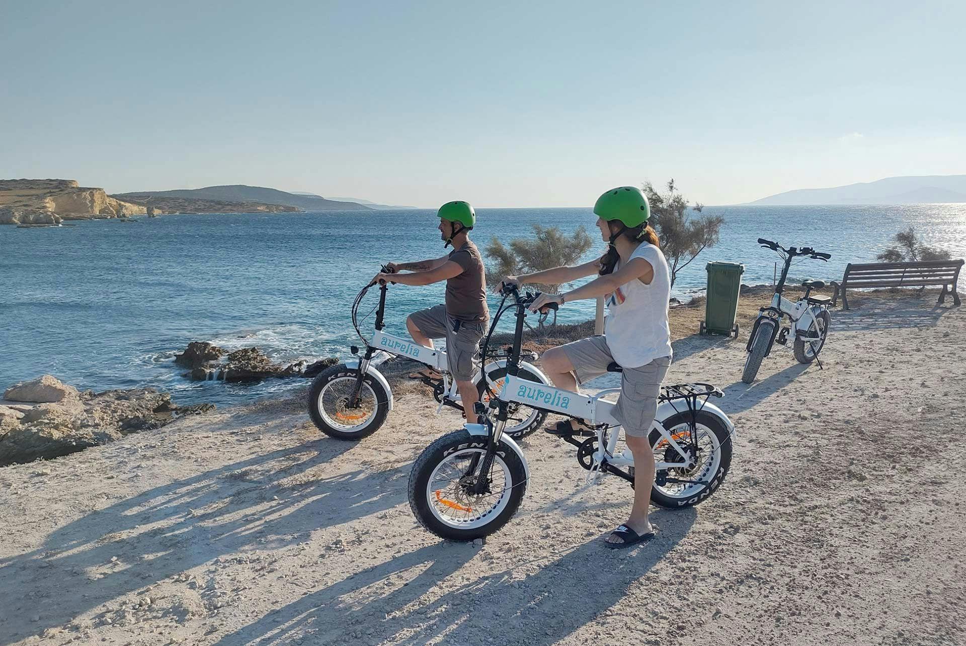 Two people on e-bikes in Agistri