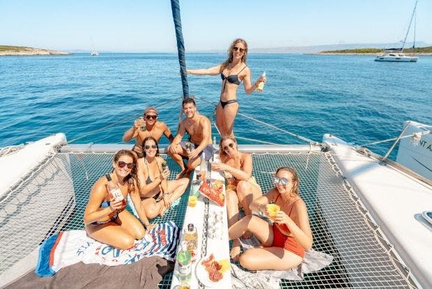 MedSailors guests enjoying drinks on the catamaran
