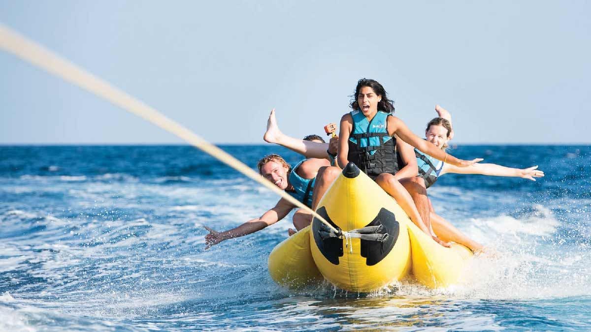Group of people on a banana boat in Greece
