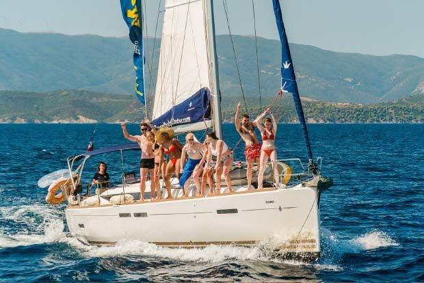Group of people dancing on a yacht