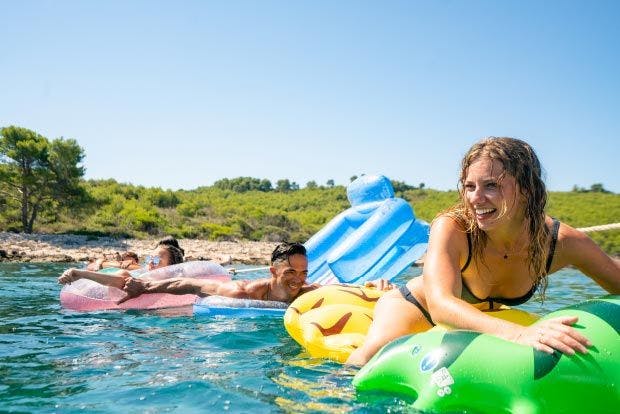 Image of people in the water on inflatables
