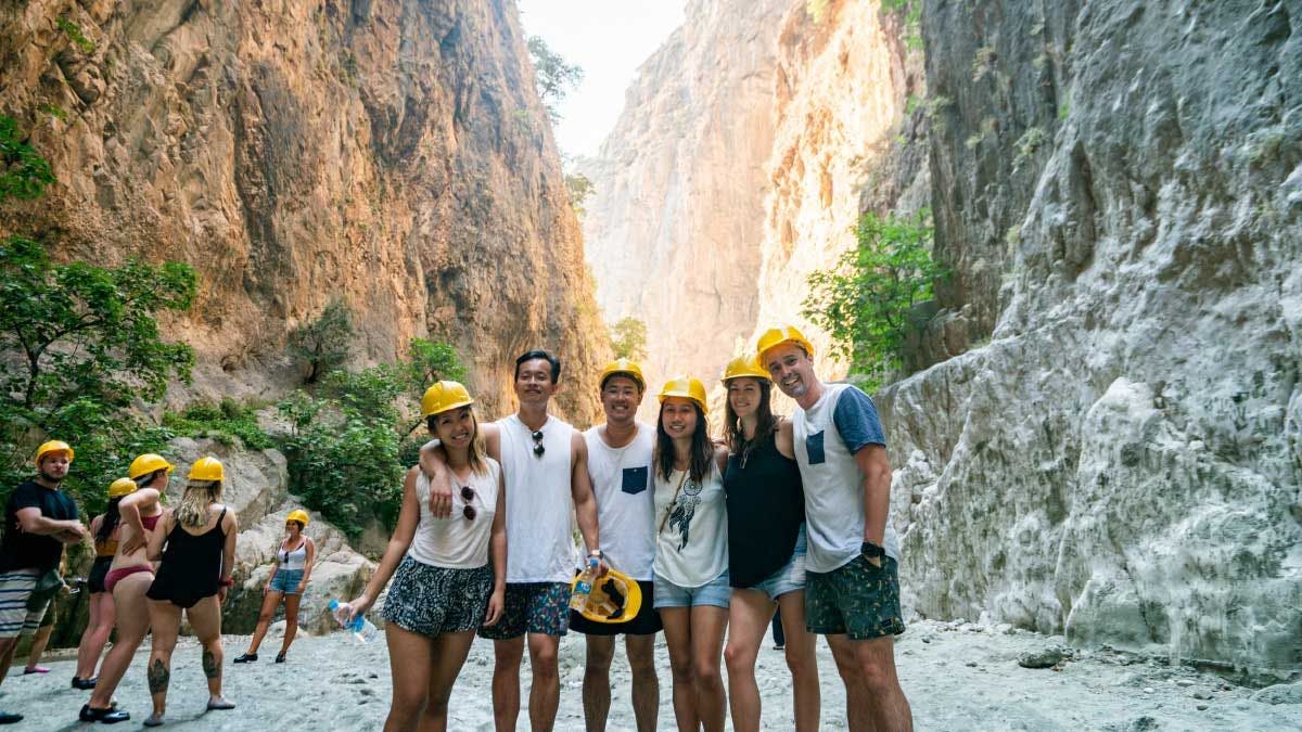 Friends pose for a photo in Saklikent Gorge in Turkey