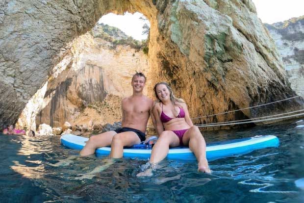 Couple on paddle board in the Paxos Blue Caves