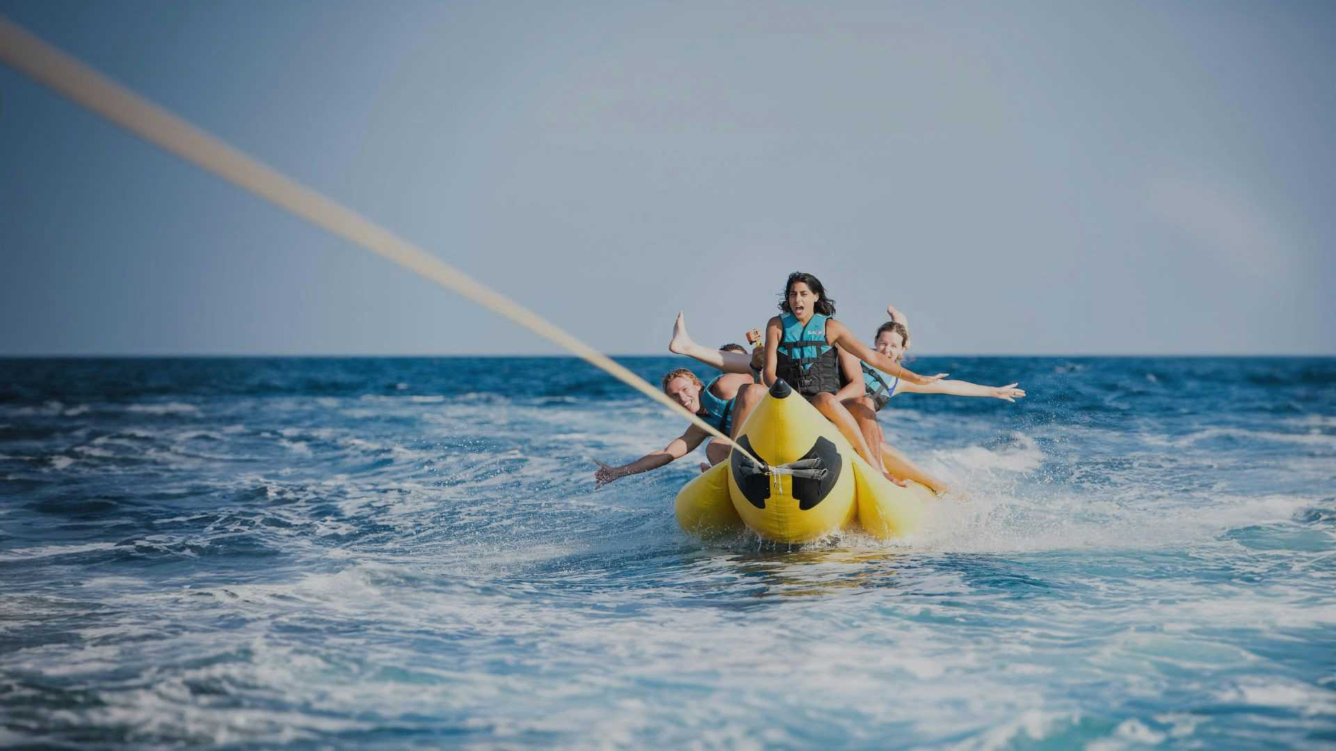 MedSailors guests riding a banana boat in Greece