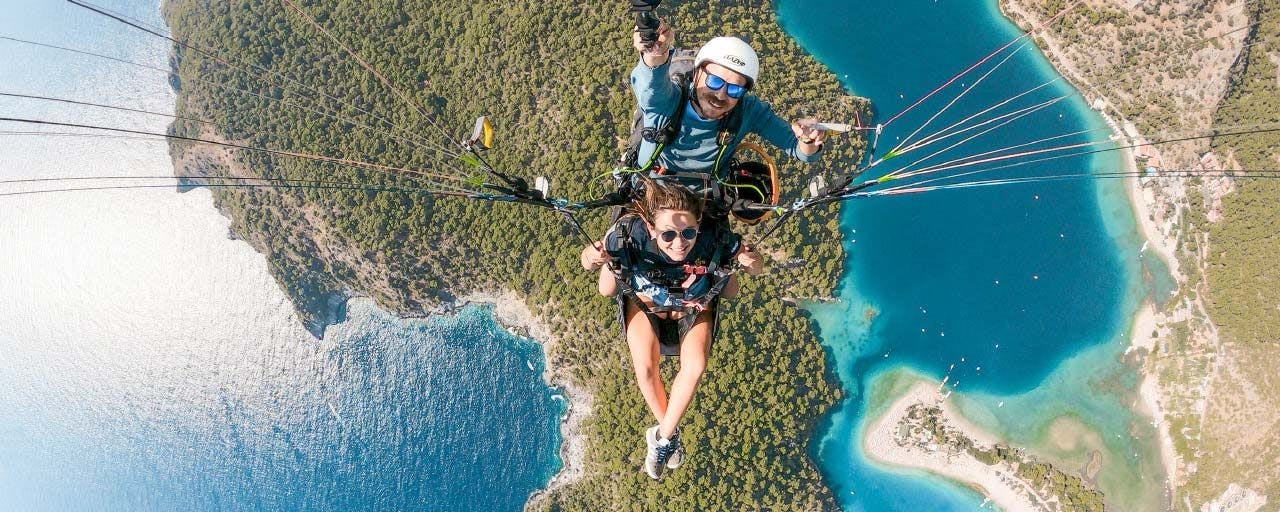Two people tandem paragliding in Turkey