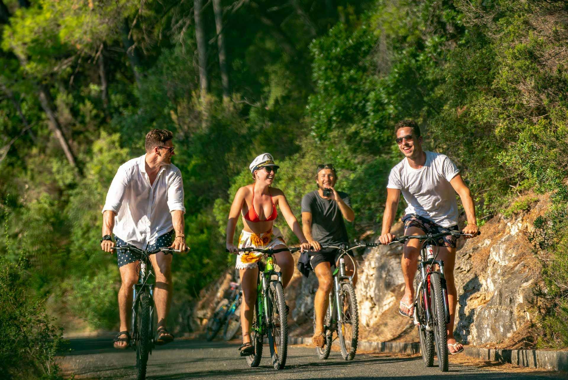 Group of friends cycling in Mljet National Park in Croatia