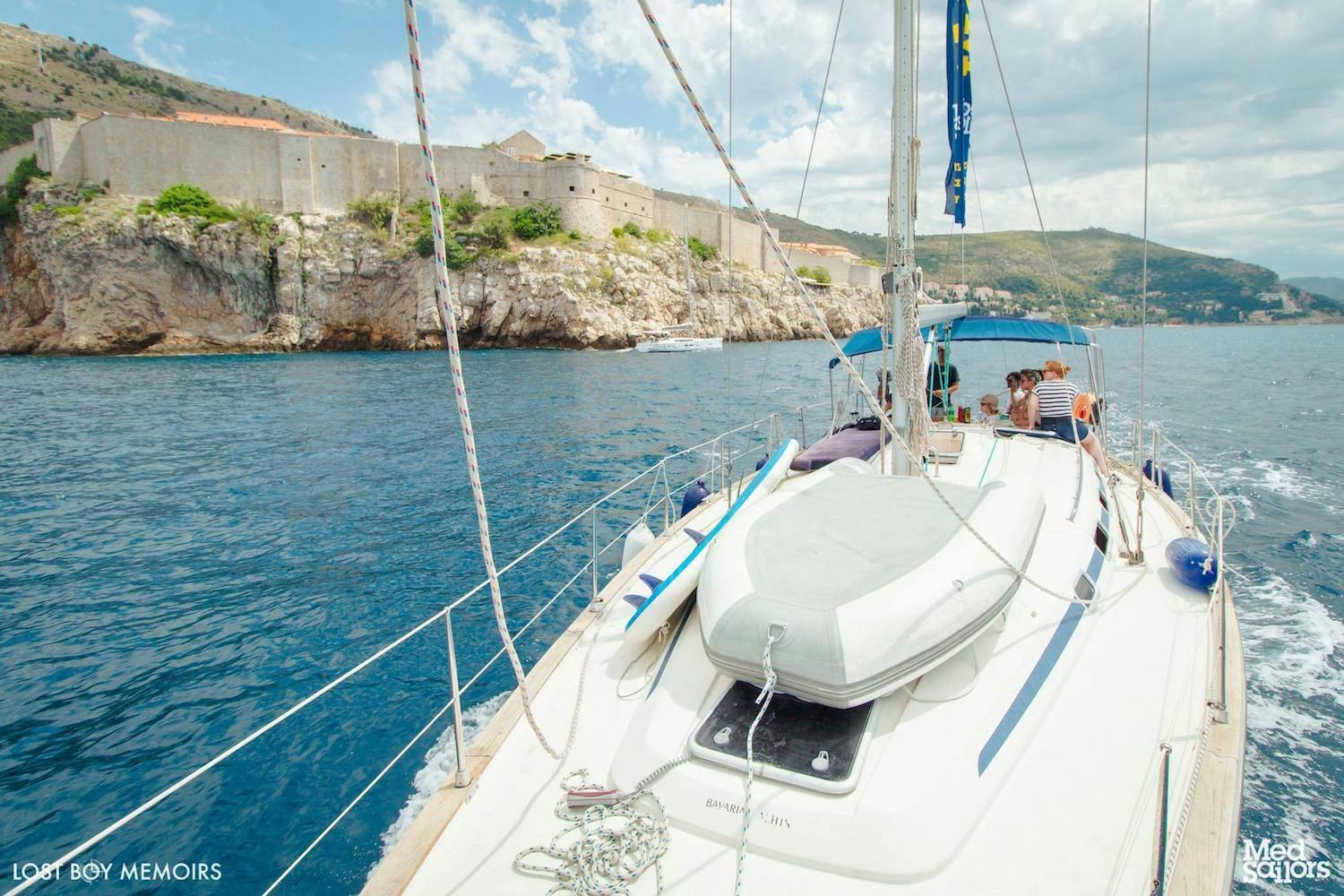 Dubrovnik Medsailors Voyager Route. 6 Things you'll learn in Dubrovnik showing the old city from a Medsailors sailing yacht. Photo by Ryan Brown of Lostboymemoirs.com