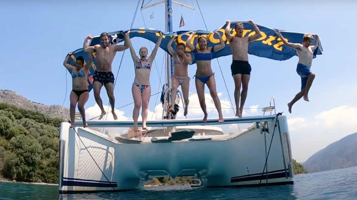 Guests jump off MedSailors catamaran