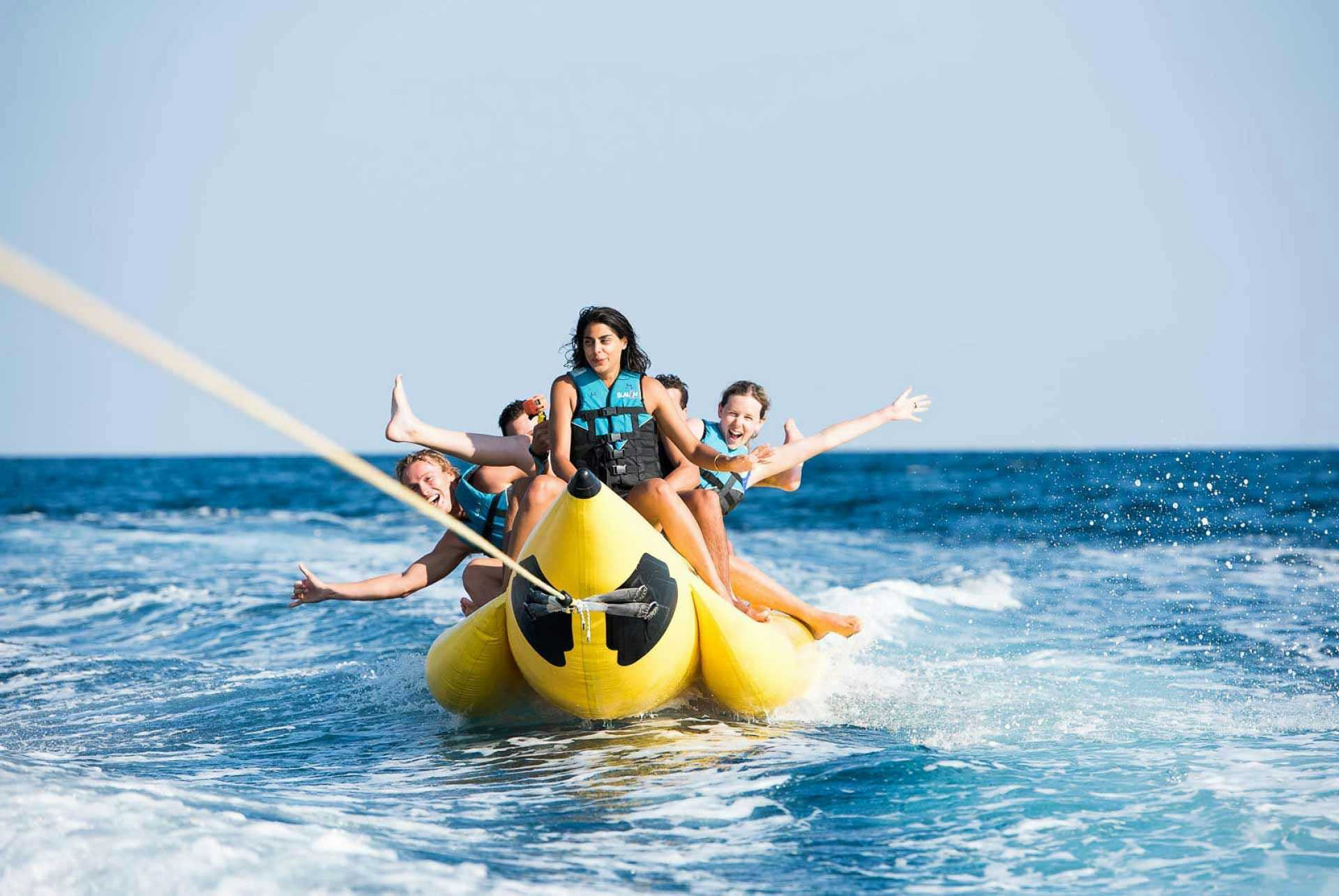 Friends on a banana boat in Poros