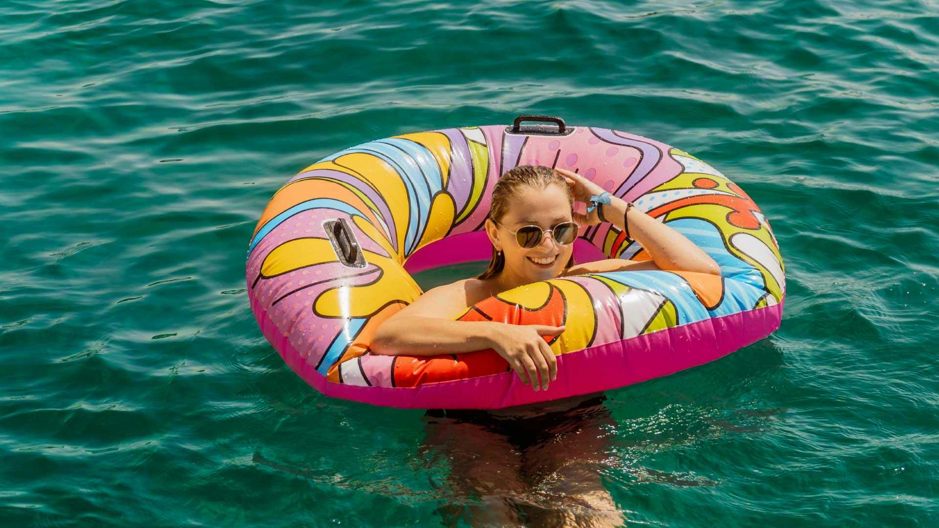 Woman relaxing in a floatie in Greece