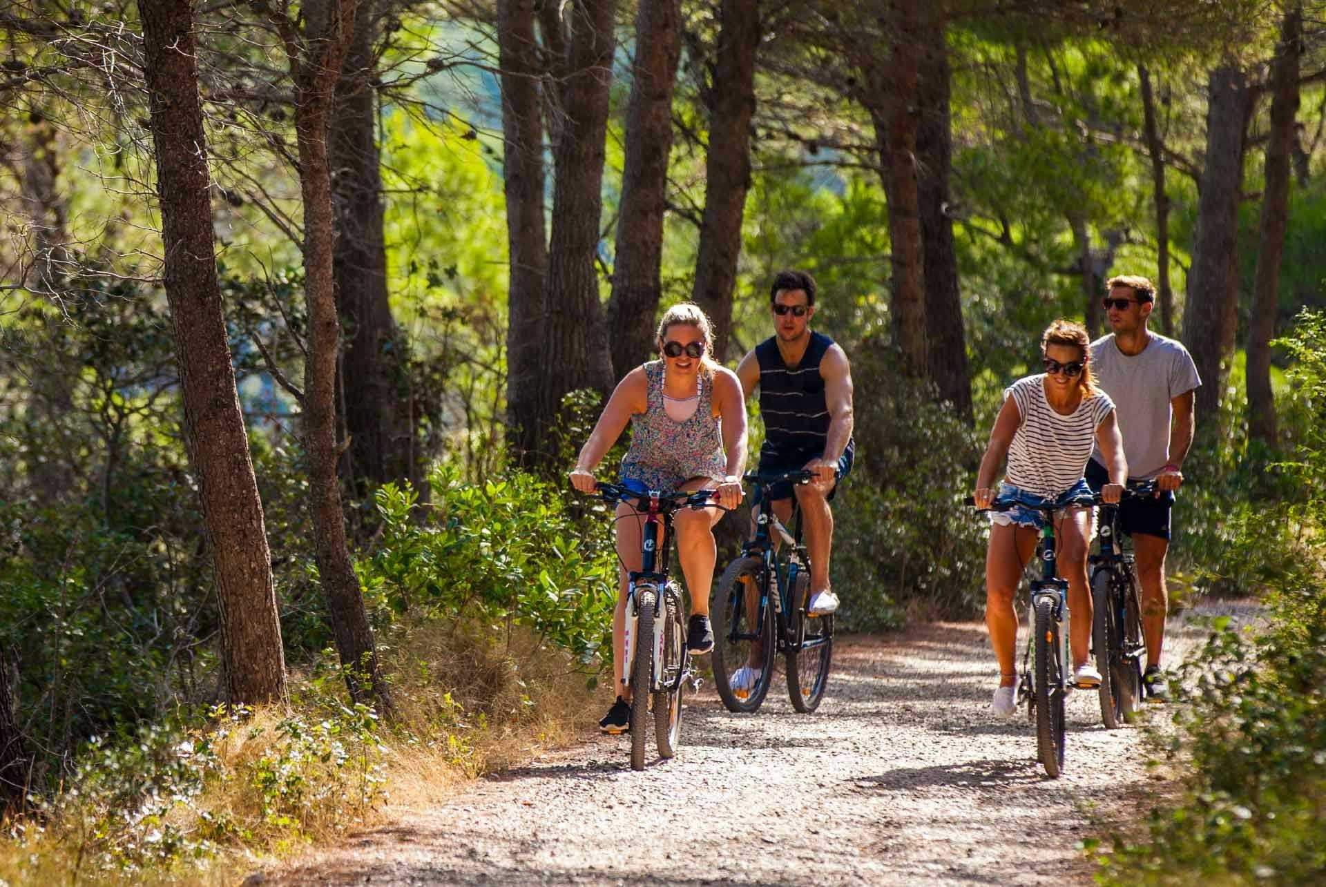 Friends cycling in Greece