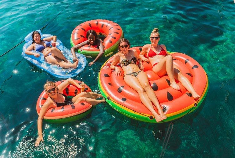 Group of women on some floaties in Croatia