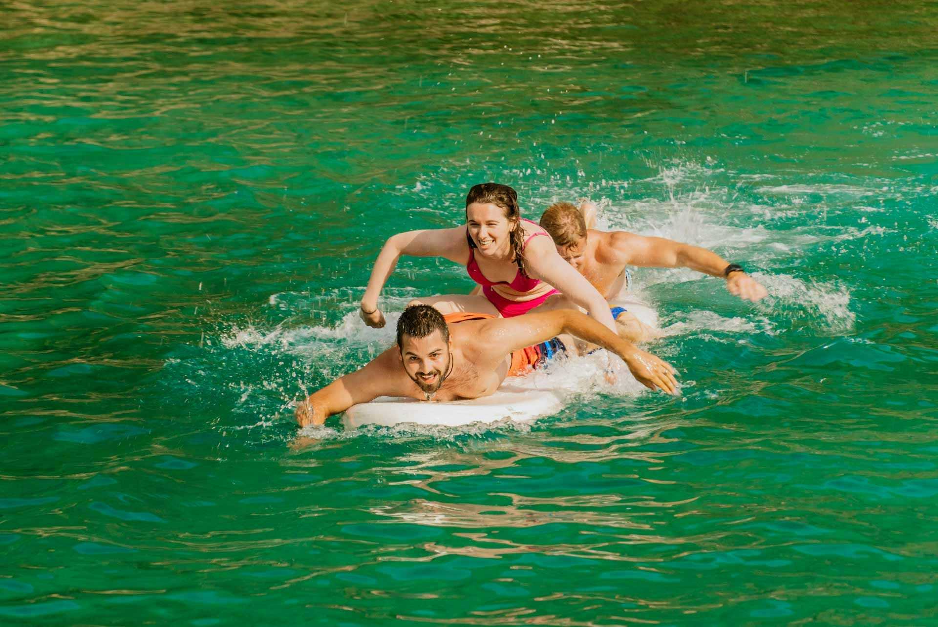 Three people paddleboarding in Croatia